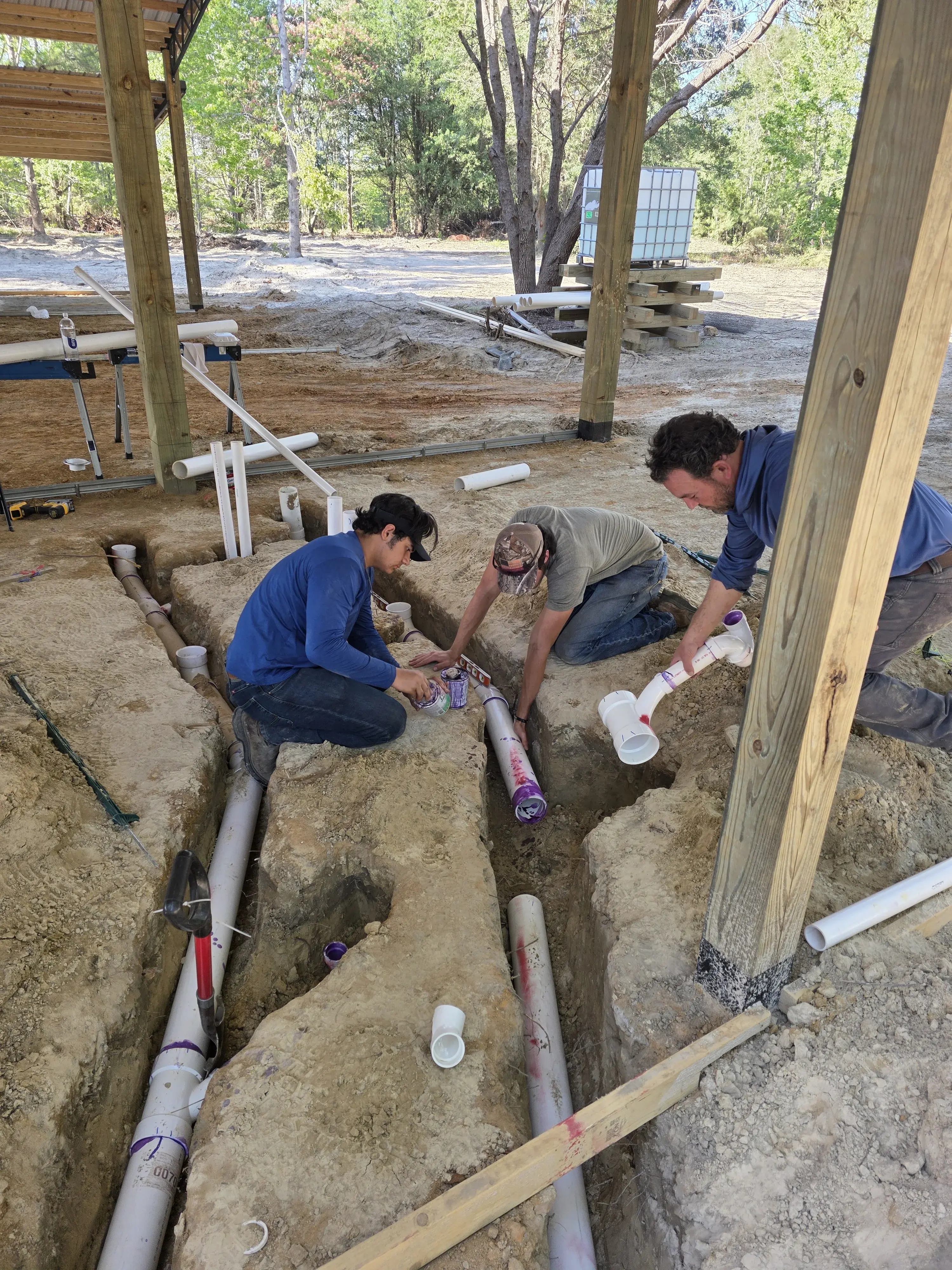 Crew installing the plumbing trench