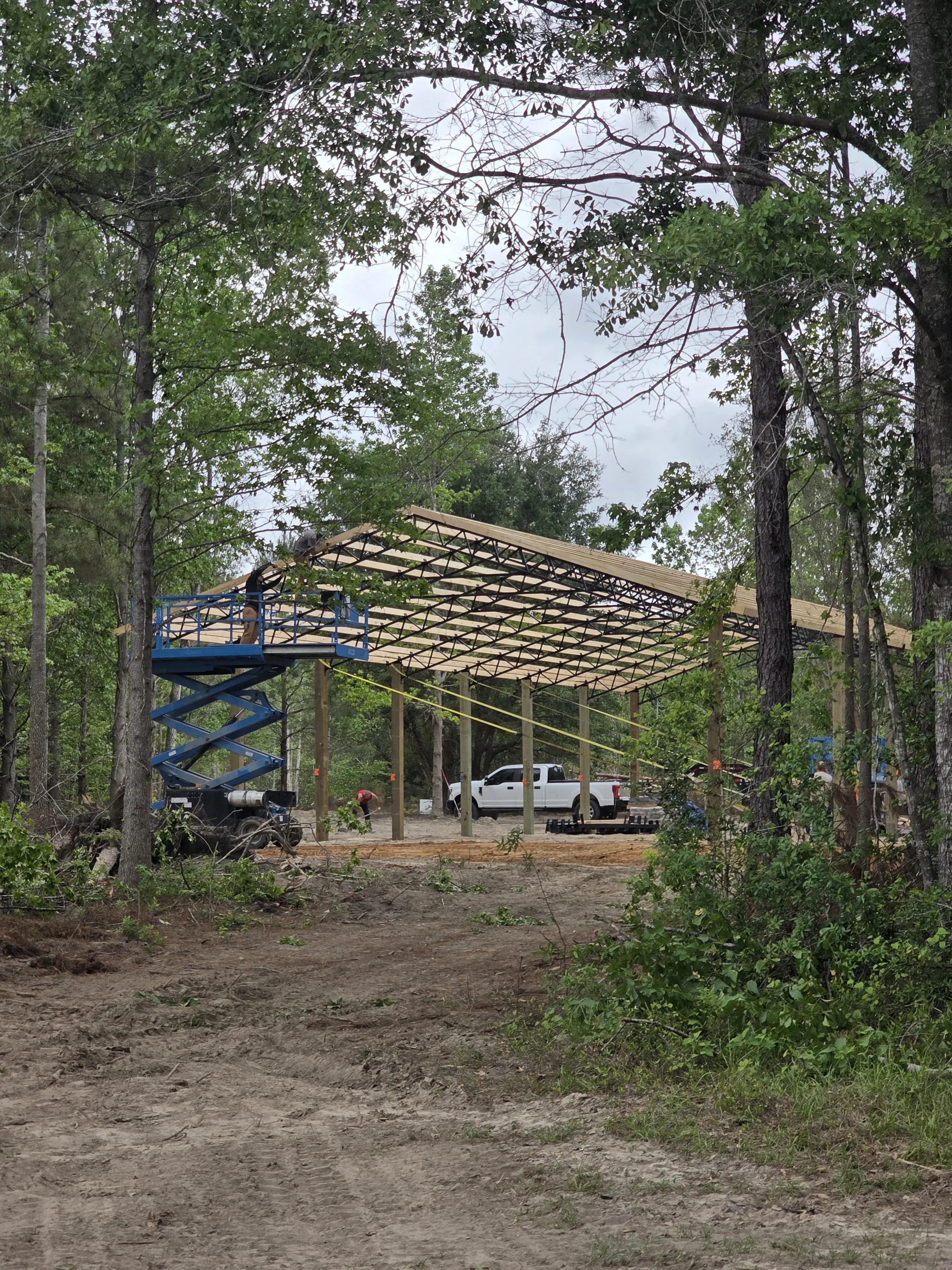 Roof trusses going up on a scissor lift